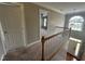 Upstairs hallway with view to entryway at 7513 Orchard Crest Ct, Apex, NC 27539