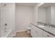 Clean bathroom, granite countertop, white cabinets and bathtub at 900 Rhino Bnd, Oxford, NC 27565
