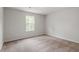 Bright bedroom featuring neutral walls and carpeted floors at 900 Rhino Bnd, Oxford, NC 27565