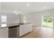 Kitchen island with granite countertop and stainless steel dishwasher at 900 Rhino Bnd, Oxford, NC 27565