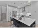 Modern kitchen with white cabinets, stainless steel appliances, and an island at 1105 Glascock St # 101, Raleigh, NC 27610