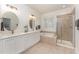 Double vanity bathroom with soaking tub and shower at 121 Hatchet Creek Ct, Morrisville, NC 27560