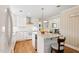 Modern kitchen with white cabinets, granite countertops, and island at 127 Fairfield Cir, Dunn, NC 28334