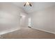 Spacious bedroom with ceiling fan and private door access at 1408 Ferrell Ct, Creedmoor, NC 27522