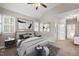 Spacious main bedroom with a ceiling fan and ensuite bathroom at 1408 Ferrell Ct, Creedmoor, NC 27522