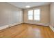 Bright bedroom with hardwood floors and vintage wallpaper at 1521 Cross Link Rd, Raleigh, NC 27610