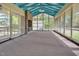 Spacious screened porch with brick fireplace and blue ceiling at 1521 Cross Link Rd, Raleigh, NC 27610
