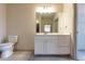 Clean bathroom with white vanity and spacious mirror at 2202 Gathering Square Ct, Fuquay Varina, NC 27526
