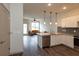 Modern kitchen with white cabinets, granite countertops, and stainless steel appliances at 2202 Gathering Square Ct, Fuquay Varina, NC 27526