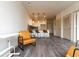 Open concept living room with kitchen views and wood-look floors at 2202 Gathering Square Ct, Fuquay Varina, NC 27526