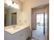 Bathroom featuring a white vanity and view into another room at 2204 Gathering Square Ct, Fuquay Varina, NC 27526