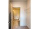 Bedroom with door open to a bathroom and closet with shelving at 2204 Gathering Square Ct, Fuquay Varina, NC 27526