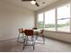 Cozy dining area with a round table and four chairs, carpeted floor, and large window at 2204 Gathering Square Ct, Fuquay Varina, NC 27526