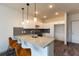 Modern kitchen with granite countertops and island seating at 2204 Gathering Square Ct, Fuquay Varina, NC 27526