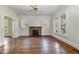 Living room with hardwood floors and brick fireplace at 225 Avent Cir, Rocky Mount, NC 27804