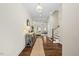 Bright foyer with hardwood floors and view to living room at 3500 Cedarbird Way, Durham, NC 27707