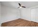 Spacious bedroom with wood floors and a ceiling fan at 4708 River Boat Landing Ct, Raleigh, NC 27604