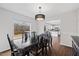 Bright dining room with a view of the kitchen and backyard at 4708 River Boat Landing Ct, Raleigh, NC 27604