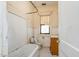 Small bathroom with vintage tub and tile flooring at 603 W Davis St, Burlington, NC 27215