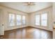 Simple bedroom with hardwood floors and large windows at 603 W Davis St, Burlington, NC 27215