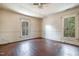 Spacious bedroom with hardwood floors and multiple windows at 603 W Davis St, Burlington, NC 27215