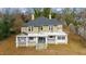 Two-story home with a wrap-around porch and mature trees at 603 W Davis St, Burlington, NC 27215