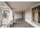 Side porch with white columns and wooden floors at 603 W Davis St, Burlington, NC 27215