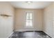 Simple spare bedroom with wood floors and a window at 603 W Davis St, Burlington, NC 27215