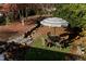 Relaxing backyard patio with seating area, water feature, and wooden bridge at 807 W Trinity Ave # 241, Durham, NC 27701