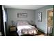 Cozy bedroom with a double bed, nightstands, and hardwood floors at 807 W Trinity Ave # 241, Durham, NC 27701