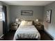 Bright bedroom with a double bed, nightstands, and hardwood floors at 807 W Trinity Ave # 241, Durham, NC 27701