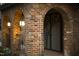 Brick exterior with arched entryway and decorative metal gate at 807 W Trinity Ave # 241, Durham, NC 27701