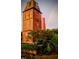 Brick building with unique architecture, situated in a garden setting at 807 W Trinity Ave # 241, Durham, NC 27701