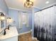 Clean bathroom with double vanity and shower/tub combo at 1354 Mudham Rd, Wendell, NC 27591