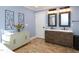 Updated bathroom with double vanity and contemporary lighting at 1354 Mudham Rd, Wendell, NC 27591