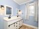 Bathroom with farmhouse style double vanity at 1354 Mudham Rd, Wendell, NC 27591