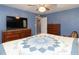 Primary bedroom with large TV and ample storage at 1354 Mudham Rd, Wendell, NC 27591
