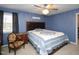 Primary bedroom with ceiling fan and dresser at 1354 Mudham Rd, Wendell, NC 27591