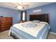 Primary bedroom with dresser, chair, and ceiling fan at 1354 Mudham Rd, Wendell, NC 27591