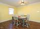 Simple dining room featuring a rustic wooden table and chairs at 1354 Mudham Rd, Wendell, NC 27591