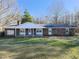 Brick ranch house with covered porch and large yard at 1354 Mudham Rd, Wendell, NC 27591