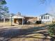 Ranch home with carport, deck, and basketball goal at 1354 Mudham Rd, Wendell, NC 27591