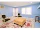 Living room with light blue walls and two armchairs at 1354 Mudham Rd, Wendell, NC 27591