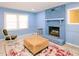 Living room with fireplace and two armchairs at 1354 Mudham Rd, Wendell, NC 27591