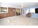 Sunroom with brick wall and views into adjacent rooms at 1354 Mudham Rd, Wendell, NC 27591