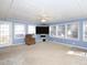 Sunroom featuring a comfortable chair and large windows at 1354 Mudham Rd, Wendell, NC 27591