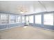 Sunroom with ample natural light and a ceiling fan at 1354 Mudham Rd, Wendell, NC 27591