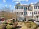 Three story townhome with driveway and landscaped yard at 1674 Snowmass Way, Durham, NC 27713