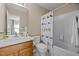 Small bathroom with shower/tub combo and bird print curtain at 1674 Snowmass Way, Durham, NC 27713