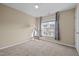 Bright bedroom with large window and floor lamp at 1674 Snowmass Way, Durham, NC 27713